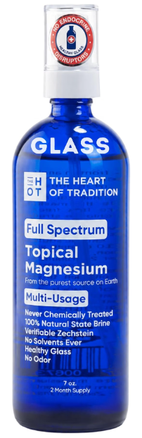 Full Spectrum topical magnesium products displayed in blue glass bottles